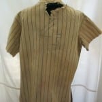 Full back view of Lou Gehrig's deteriorated jersey before conservation.