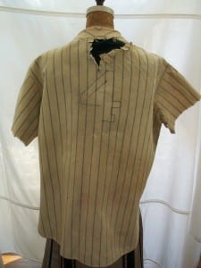 Full back view of Lou Gehrig's deteriorated jersey before conservation.