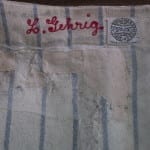 Interior of Lou Gehrig's jersey after conservation, showing stabilizing patches.