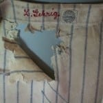 Conservation treatment of a large hole in Lou Gehrig's baseball jersey.