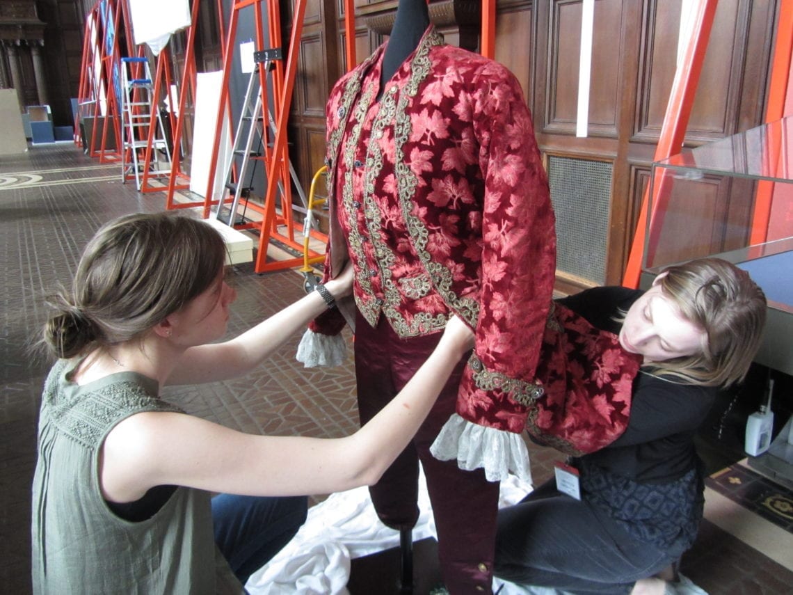 Kaitlyn and Lauren dressing for display at the Folger. 