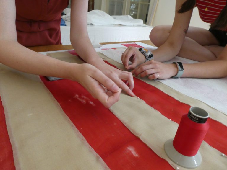 hand stitching damaged flag with nylon thread