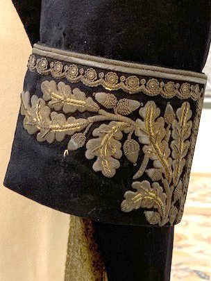 detail of gold stitching on blue jacket cuff
