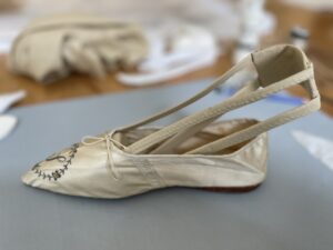 Mother Seton's ivory silk slipper during treatment process.