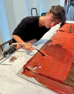 petersen-bio-image | Caring For Textiles Oliver Petersen working on restoration of orange canvas fabric